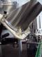 Alimentador e posicionador de tampas rotativo autom�tico